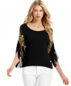MICHAEL Michael Kors' latest top is total glam with fringed sleeves and a ton of shiny studs, chains and grommets.