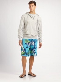 Classic swim trunk style comes to life in a bright floral print pattern, with side pocket detail in quick-drying nylon.Drawstring tie waistInseam, about 10Fully linedPolyesterMachine washImported Classic swim trunk style comes to life in a bright floral print pattern, with side pocket detail in quick-drying nylon.Drawstring tie waistInseam, about 10Fully linedPolyesterMachine washImported
