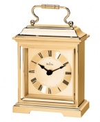 This formal carriage clock by Bulova adds elegance to an end table or side board. Rectangular spun and brushed gold tone aluminum case features a curved handle at top. Gold tone dial displays black Roman numerals and two hands.