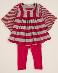 A voluminous tunic featuring oversized flutter sleeves and an a-line body, rendered by Little Ella in brightly hued mixed stripes. A voluminous tunic featuring oversized flutter sleeves and an a-line body, rendered by Little Ella in brightly hued mixed stripes.