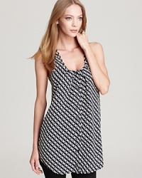 Black and white never goes out of style. Update the classic color combination with this Aqua racerback tank in a cool chainlink print. The tunic length makes it the perfect top for leggings of skinny jeans. Black and white never goes out of style. Update the classic color combination with this Aqua racerback tank in a cool chainlink print. The tunic length makes it the perfect top for leggings of skinny jeans.
