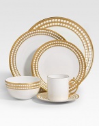 A beautiful dinner plate in fine Limoges porcelain, made entirely by hand and finished with individually-applied 14k gold along the pearl border. From the Perlee Gold Collection Porcelain 10½ diam. Dishwasher safe Imported 