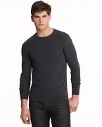 Long sleeve crewneck with wide cuff bands. Slimmer fitting with logo embroidered at bottom hem.