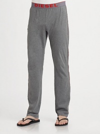 Soft cotton lounge pants with a logo waistband and athletic stripe along sides.Elasticized logo waistbandBack pocketInseam, about 32CottonMachine washImported Soft cotton lounge pants with a logo waistband and athletic stripe along sides.Elasticized logo waistbandBack pocketInseam, about 32CottonMachine washImported