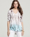 Tie-dye climbs up this XCVI cotton top for an earthy-chic take on casual wear. An on-trend dipped hem and a sheer back amp up the style factor.