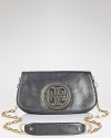 When the ordinary evening bag just won't do, this glittery Tory Burch clutch steps in, styled in metallic coated leather and detailed with a stacked logo.