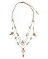 Simple and sweet. A dainty three-layer illusion necklace by Betsey Johnson features delicate chains decorated with acrylic pearls, crystal keys, and heart charms. Crafted in silver and gold tone mixed metal. Approximate length: 16 inches + 3-inch extender. Approximate drop: 3 inches.