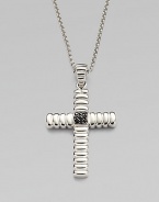 A polished cross pendant is suspended from a chain necklace, both crafted in sterling silver.From the Bedeg CollectionSterling silverPendant, 1¼W x 1½HNecklace, 24 lengthImported