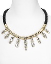Crystal stones dress up a twisted cord on this collar necklace from nOir. Equal parts crafty and cool, it instantly adds some summer-perfect sparkle.