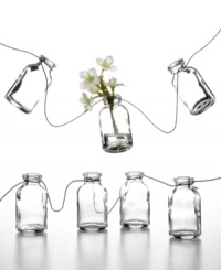 Garden garland. Mini glass bottles strung along a stainless steel wire offer a charming new way to spruce up backyard patios or casual kitchen decor. Personalize it with flowers, seashells or any number or colorful trinkets. Garden garland. Mini glass bottles strung along a stainless steel wire offer a charming new way to spruce up backyard patios or casual kitchen decor. Personalize it with flowers, seashells or any number or colorful trinkets.