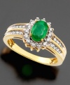 A ring fit for royalty. Stunning oval-cut emerald (3/4 ct. t.w.) is surrounded by sparkling diamonds (3/8 ct. t.w.) crafted in 14k gold.