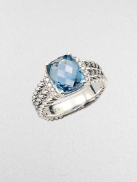 From the Petite Wheaton Collection. A stunning, faceted blue topaz stone flanked by brilliant diamonds on a sterling silver, triple-row shank. Blue topazDiamonds, .1 tcwSterling silverImported