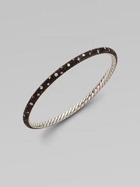 From the Midnight Melange Collection. This perfectly, elegant design boasts a beautiful, blackened sterling silver textured surface with a smattering of brilliant diamonds. Blackened sterling silverDiamonds, 1.04 tcwSterling silverWidth, about 1/8Diameter, about 2½Slip-on styleImported From the Midnight Melange Collection. This perfectly, elegant design boasts a beautiful, blackened sterling silver textured surface with a smattering of brilliant diamonds. Blackened sterling silverDiamonds, 1.04 tcwSterling silverWidth, about 1/8Diameter, about 2½Slip-on styleImported
