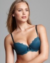 A soft t-shirt bra with contrast stitching and double spaghetti straps. Molded cups provide extra support. Demi coverage. Lace trim accents the sides. Center front bow with contrast stitching. Finished with adjustable straps and hook and eye closure. Style #3086