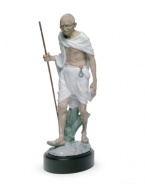 An homage to political activist and revered philosopher Mahatma Gandhi, this elaborate Lladro collectible depicts the historic figure in artfully glazed porcelain.