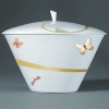 For over two centuries Raynaud has created unique Limoges porcelain, with a marked preference for relief shapes and generously colored and gilt decorations. Metamorphoses is a striking pattern of red and gold with a butterfly motif.