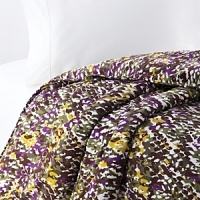 Resembling snake skin, but in bright hues of yellow, green and purple, this collection is sure to give life to any bedroom. Resembling snake skin, but in bright hues of yellow, green and purple, this collection is sure to give life to any bedroom.