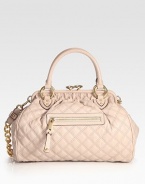 The iconic quilted leather bag with a signature kiss-lock closure and glamorous chain strap. Double top handles, 5 drop Chain and leather shoulder strap, 12 drop Kiss-lock closure One outside zip pocket Protective metal feet One inside zip pocket Cotton lining 14½W X 10H X 6D Made in Italy