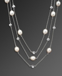 Add a little illumination with this elegant illusion necklace by CRISLU. Feature three delicate strands of bezel-set cubic zirconias (4-3/4 ct. t.w.) and freshwater pearls (8 mm). Set in platinum over sterling silver. Approximate length: 48 inches. Add a little illumination with this elegant illusion necklace by CRISLU. Feature three delicate strands of bezel-set cubic zirconias (4-3/4 ct. t.w.) and freshwater pearls (8 mm). Set in platinum over sterling silver. Approximate length: 48 inches.