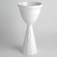 Judaica is a twist on the best selling Louvre pattern from Bernardaud. Pieces from this collection make perfect gifts for the holidays or for the couple who treasures their heritage. The Bernardaud service was engraved by hand, following the grand tradition of master sculptors. Casual or formal, the collection expresses a unique personality of quality craftsmanship. Available pieces include: set of 6 mini seder plates; kiddush cup; matzah plate; mezuzah; rice bowl; and seder plate. The set of 6 mini seder plates are sold separately from the seder plate. Judaica is a twist on the best selling Louvre pattern from Bernardaud. Pieces from this collection make perfect gifts for the holidays or for the couple who treasures their heritage. The Bernardaud service was engraved by hand, following the grand tradition of master sculptors. Casual or formal, the collection expresses a unique personality of quality craftsmanship. Available pieces include: set of 6 mini seder plates; kiddush cup; matzah plate; mezuzah; rice bowl; and seder plate. The set of 6 mini seder plates are sold separately from the seder plate.