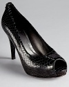 Stuart Weitzman reinvents a classic with the Sierra platform, a snake embossed pump with a hint of attitude.