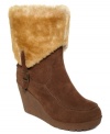 Cozy and fabulous. Bearpaw's Flatbush boots feature a sheepskin and wool blend lining plus a leather heel logo.