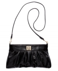 This classic look is a staple piece every girl needs in their handbag collection. A shiny python print covers this Anne Klein bag for a modern appeal, while a goldtone plaque and pretty pleating add the perfect amount of polish. Simply unhook strap to use this style as a clutch. This classic look is a staple piece every girl needs in their handbag collection. A shiny python print covers this Anne Klein bag for a modern appeal, while a goldtone plaque and pretty pleating add the perfect amount of polish. Simply unhook strap to use this style as a clutch.