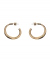 Spruce up your look with essential accessories. 3/4 style hoops by Kenneth Cole New York feature a post setting in worn gold tone mixed metal. Approximate diameter: 1 inch.