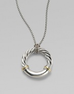 From the Metro Collection. A sleek, sophisticated circle, combining smooth and cabled sterling silver with accents of 18k gold, hangs from a richly textured silver chain and bale. Sterling silver and 18k yellow gold Chain length, about 18 Pendant diameter, about 1¼ Spring ring clasp Imported