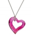 Add a lovely look in hot pink style. Swarovski's love heart pendant features a fuchsia crystal with a chic open-cut design. Setting and wrapped chain crafted in silver tone mixed metal. Approximate length: 15 inches. Approximate drop: 1 inch.
