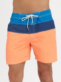 A summer essential for the beach, poolside and beyond set in colorblocked nylon for a crisp, contemporary finish.Drawstring waistSide slash, back welt pocketInseam, about 565% cotton/35% nylonMachine washImported