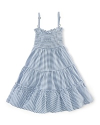 A stylish striped jersey dress is updated with smocked detailing and a pretty flared silhouette. A stylish striped jersey dress is updated with smocked detailing and a pretty flared silhouette.