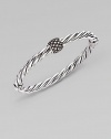 A bold cable bangle of sterling silver, with a rhodium-plated diamond rondelle as its centerpiece. Diamonds, 0.43 tcw Sterling silver and rhodium plating Cable, 6mm Diameter, about 2½ Made in USA