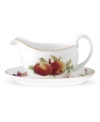 Ripe peaches and sweet summer berries enhance the Evesham gravy boat and stand, crafted of pristine porcelain with lustrous gold banding by Royal Worcester.