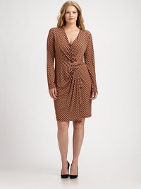 A signature Michael Michael Kors design featuring a simply stylish print. You will love how its feminine neckline, draped center and hint of stretch flatter your shape.V-necklineLong sleevesLogo detail at draped centerAllover printAbout 25 from natural waistPolyester/spandexMachine washImported A signature Michael Michael Kors design featuring a simply stylish print. You will love how its feminine neckline, draped center and hint of stretch flatter your shape.V-necklineLong sleevesLogo detail at draped centerAllover printAbout 25 from natural waistPolyester/spandexMachine washImported