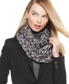 Elevate your style status with this logo pattern infinity scarf from MICHAEL Michael Kors. Adds instant allure to blazers, overcoats or your favorite cozy sweater.
