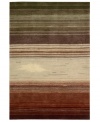 Variegated stripes of earthy tones into warm reds creates a design as artistically moving as it is functional. Hand tufted of long polyester fibers for added strength and softness, the Contour area rug from Nourison creates an ideal accent for any modern room. (Clearance)