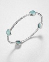 From the Renaissance Collection. Let this beautiful piece take you back in time with cabochon aqua chalcedony stations on an iconic sterling silver cable design. Aqua chalcedonySterling silverDiameter, about 2.25Slip-on styleImported 