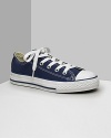 Low cut Converse All Stars. This classic canvas sneaker set the standard in cool and comfort. Available in kids sizes. With lace-up canvas uppers, contrast stitching and rubber sole and toe.