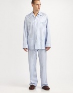 A luxurious cotton two-piece set, soft enough to lounge around in all night and day. Machine wash. Imported.SHIRTButtonfrontSpread collarChest, waist patch pocketsPANTSFlat-front styleAdjustable two-button waistSide elastic waist insetsNo flyInseam, about 31