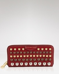 This MARC BY MARC JACOBS wallet is equal parts smarts and sass. Its exterior is detailed with bold studs, while its lined interior is organized for the essentials. This MARC BY MARC JACOBS wallet is equal parts smarts and sass. Its exterior is detailed with bold studs, while its lined interior is organized for the essentials.
