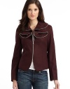 THE LOOKOversized ruffle collar with silver zipper trimLong sleeves with side slitsWelted princess seams front and backZip front closureFully linedTHE FITAbout 22 from shoulder to hemTHE MATERIALVirgin woolCARE & ORIGINDry cleanImported