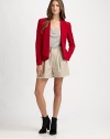 The tailored silk blazer, cropped and fitted with a single-button closureFoldover lapelsDefined shouldersWelt pocketsContour hem shorter in backAbout 24½ from shoulder to hemSilkDry cleanImported