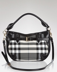 Let the British invade your closet in high style with Burberrry's signature check crossbody. Shoulder the black and white bag for timeless chic over cashmere and a color-pop coat. Let the British invade your closet in high style with Burberrry's signature check crossbody. Shoulder the black and white bag for timeless chic over cashmere and a color-pop coat.