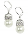 Elegance to last through the ages. Givenchy's sophisticated drop earrings feature polished glass pearls and sparkling crystals. Crafted in silver tone mixed metal. Approximate drop: 1-1/2 inches.