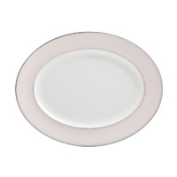 World-renowned fashion designer Monique Lhuillier collaborated with Waterford to create this fine china platter in beautiful blush tones adapted from her brilliant couture bridal gowns and red carpet creations. World-renowned fashion designer Monique Lhuillier collaborated with Waterford to create this fine china platter in beautiful blush tones adapted from her brilliant couture bridal gowns and red carpet creations.