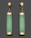 Whether for an elegant evening affair or to add simple color to a casual outfit, these polished green drops are the perfect finishing touch. Solid jade cylinders (4 mm x 15 mm) add subtle color in a 14k gold post setting. Approximate drop: 1/2 inch.