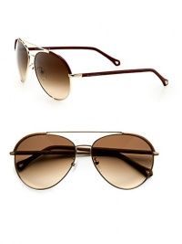 Lightweight metal design with leather detail for an incredibly modern touch. Available in shiny rose gold frames with gradient brown lenses.Metal/leather100% UV ProtectionMade in Italy Lightweight metal design with leather detail for an incredibly modern touch. Available in shiny rose gold frames with gradient brown lenses.Metal/leather100% UV ProtectionMade in Italy