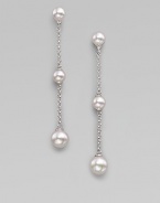 Graceful chains of sterling silver have round white pearls at the top, the bottom and in the middle as they dangle delicately. 6mm and 8mm white round organic man-made pearls Sterling silver Drop, about 2¾ Post back Made in Spain