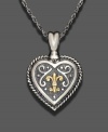 Victorian elegance reigns in this 14k gold and sterling silver heart pendant. Approximate length: 24 inches. Approximate drop: 1-1/2 inches.